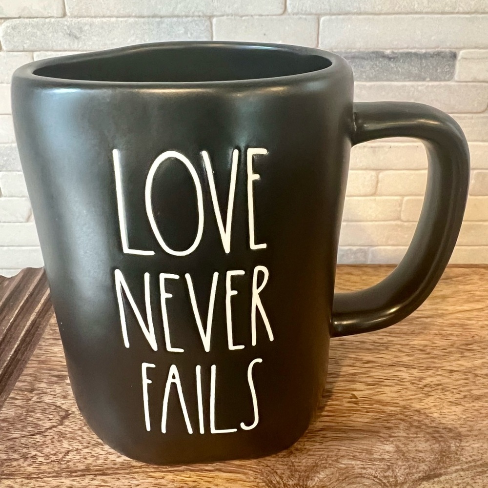Rae Dunn Black LOVE NEVER FAILS Mug
